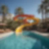 A stunning pool slide spiraling into a vibrant hotel pool